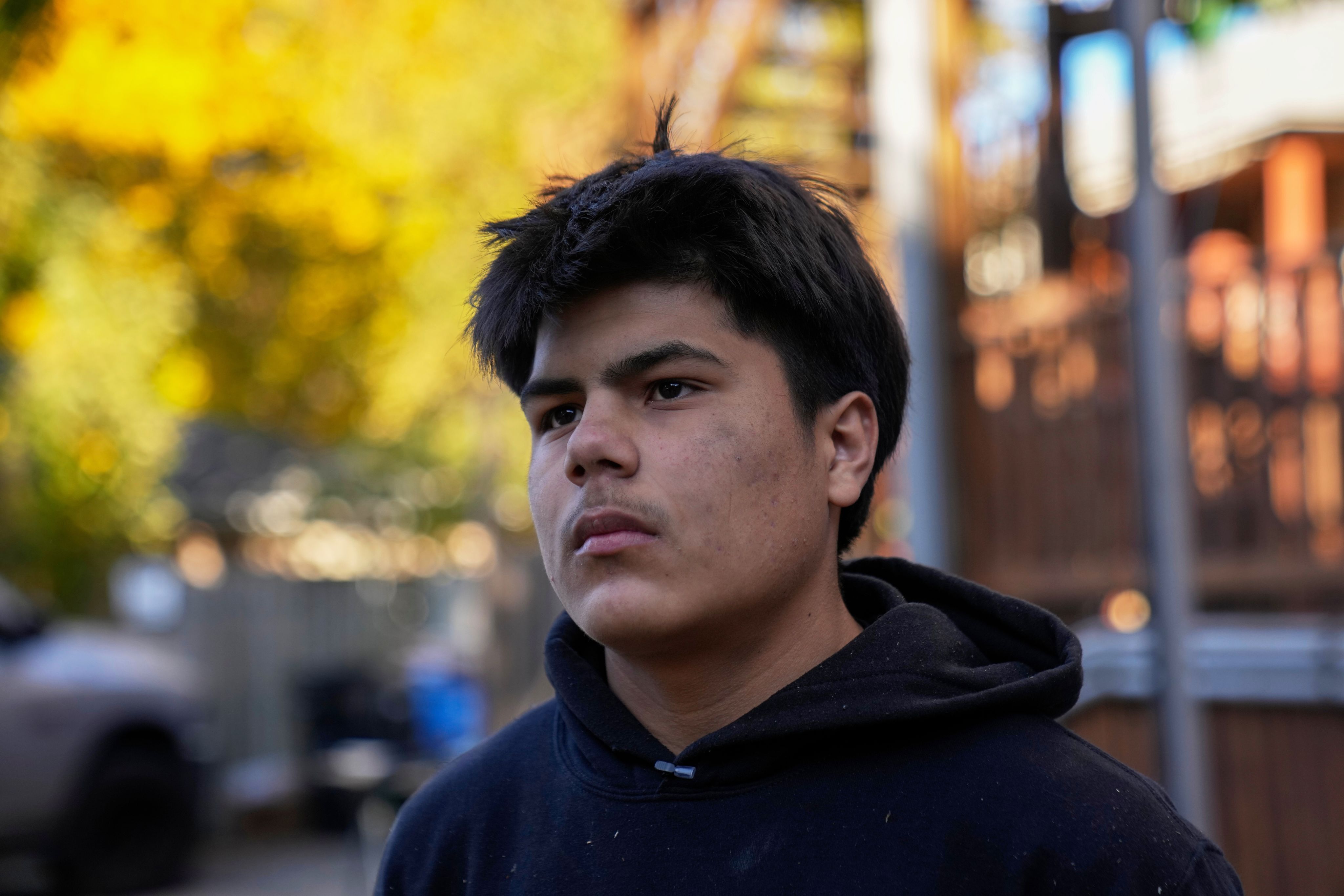 Uriel Villegas, who recorded cell phone video of the incident involving his older brother and as agents arrested two others in October, stands at the construction site where his older brother was taken last month by federal immigration agents, Nov. 18, 2025, in Chicago. (AP Photo/Erin Hooley)